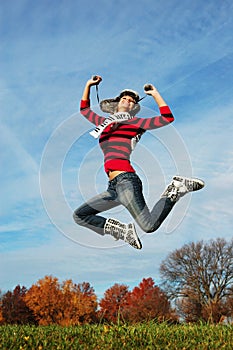 Happy girl jumping of joy
