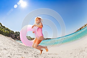 Happy girl jumping spending vacation on the beach