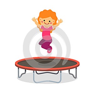 Happy girl jumping on trampoline photo