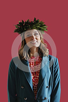 happy girl just graduated with laurel wreath on her head