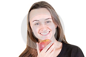 Happy girl with large smile holding red apple