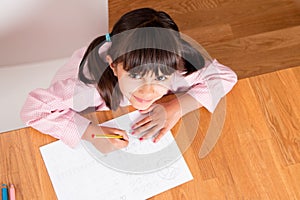 Happy girl learning to write