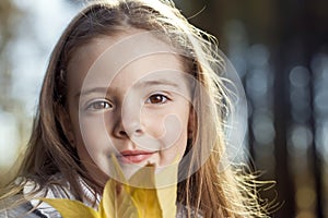 Happy girl in leaves autumn