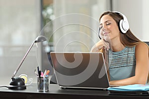 Happy girl listening to music with headphones