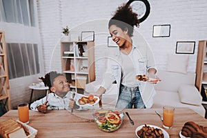 Happy Girl with Mother Food Together. Smile Girl.