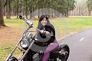 Happy girl on a motorcycle