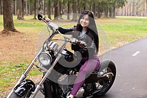 Happy girl on a motorcycle