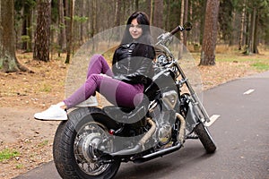 Happy girl on a motorcycle