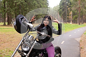 Happy girl on a motorcycle