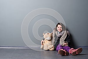 Happy girl and old toy