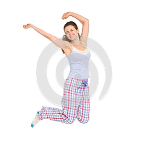 Happy girl in pajamas jumping