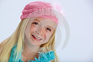 Happy girl in pink woollen hat photo