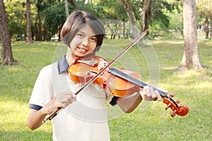 Happy girl playing her violin