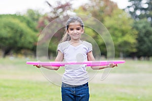 happy girl playing with hula hoops