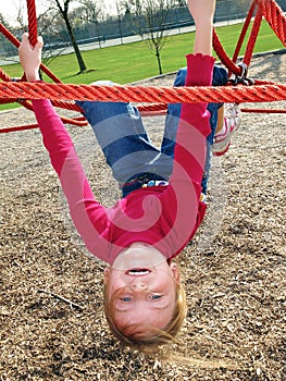 Happy girl playing at playground.