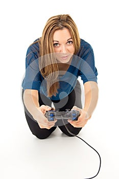Happy girl playing video games on the joystick