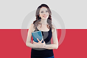 Happy girl on the Poland flag background. Travel and learn polish language concept
