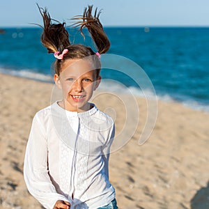 Happy girl with ponytails. photo