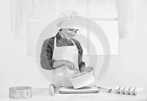 happy girl prepares dough in kitchen, culinary