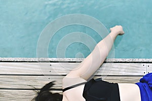 Happy girl relaxing around the swimming pool, Summer holiday vacation concept.