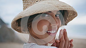 Happy girl resting seashore on vacation portrait. Smiling beautiful woman posing