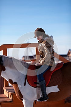 Happy girl riding horse