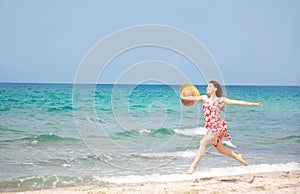 Happy girl running on beach