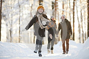 Happy Girl Running in Winter Forest