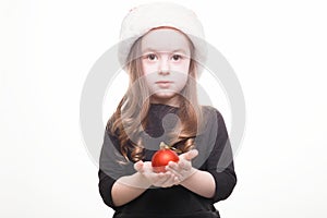 Happy girl in santa hat with gift on white background. Funny young child waiting for christmas, new year and presents. holiday,