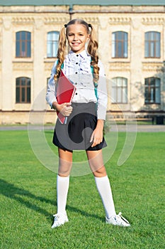 Happy girl in school uniform. Teenage girl back to school. Education in school