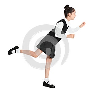 Happy girl in school uniform walking on white