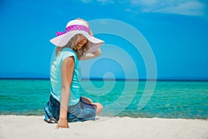 happy girl at sea in greece on sand nature