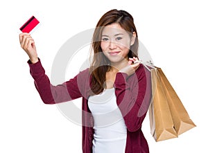 Happy girl with shopping bag and credit card