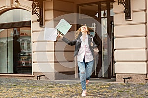 Happy girl in shopping. Happy woman with shopping bags enjoying in shopping. Seasonal sales, shopping, lifestyle concept. Excited