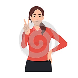 Happy girl shows hand gesture, victory sign. Portrait of beautiful young woman