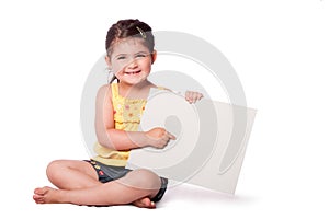 Happy girl sitting pointing at whiteboard