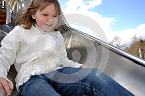 Happy girl on slide