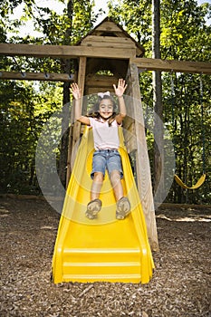 Happy girl sliding.