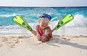 Happy girl with snorkeling equipment