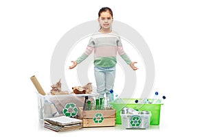 happy girl sorting paper, metal and plastic waste