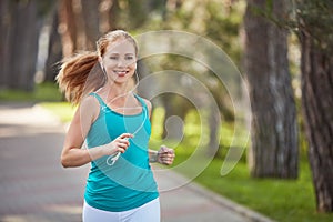 Happy girl in for sports and fitness jogging in the summer