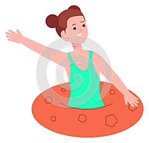 Happy girl swimming in floating ring. Summer kid activity