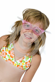 Happy girl in swimming goggles