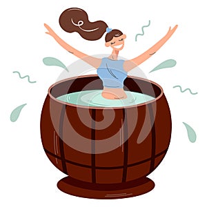 Happy girl takes spa treatments in the hot tub or cedar barrel. Pretty woman relieves stress in a sauna or steam room. A