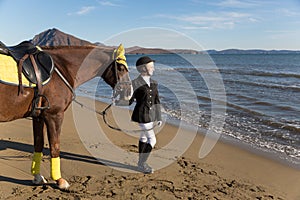 Happy girl teenager with his horse