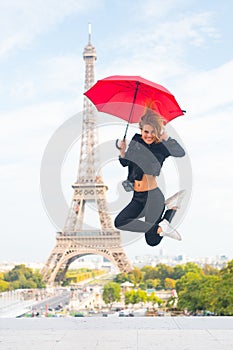 Happy girl travel in paris, france. Woman jump with fashion umbrella. Parisian on white background. Woman with