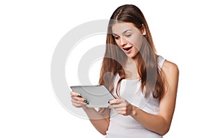 Happy girl using tablet. Excited woman with tablet pc, on white background