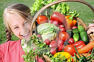 Happy girl with of vegetables