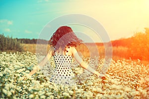 Happy girl walking on the buckwheat field