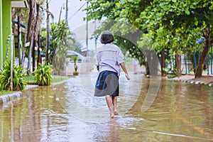 Happy girl walking to flood